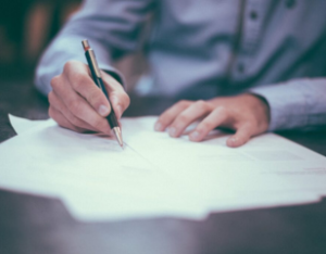 Hands holding a paper